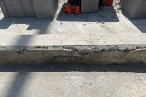 eroded concrete curb
